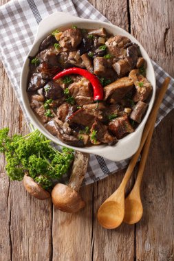 beef stew with wild mushrooms, onion and chili pepper close up i clipart