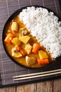 Spicy curry and rice on a plate in Japanese style. Vertical top  clipart