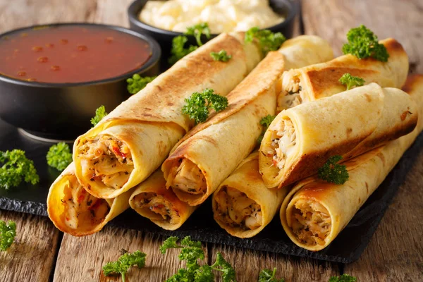 Baked taquitos with chicken and cheese close-up. horizontal — Stock Photo, Image