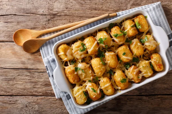 American Food: Tater Tots with cheese, meat, corn and parsley cl — Stock Photo, Image