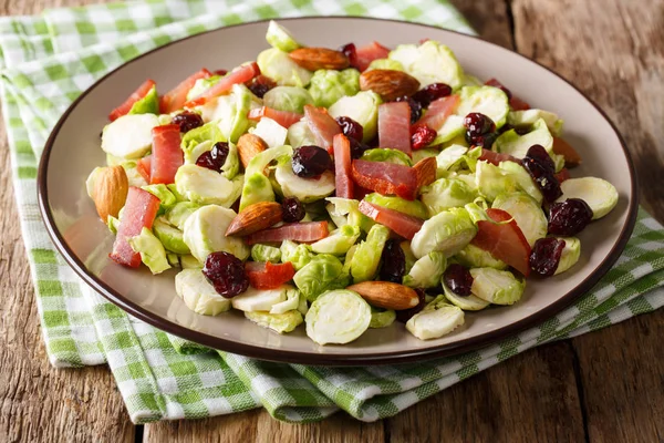 Healthy food: salad from Brussels sprouts, cranberries, almonds — Stock Photo, Image