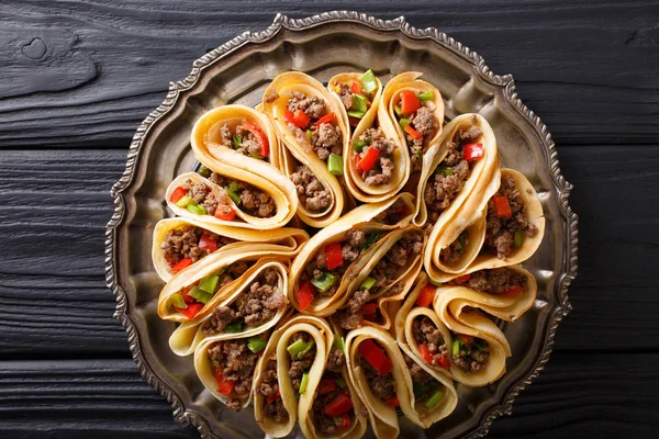 Pancakes stuffed with meat beef, peppers and onions closeup. Hor — Stock Photo, Image