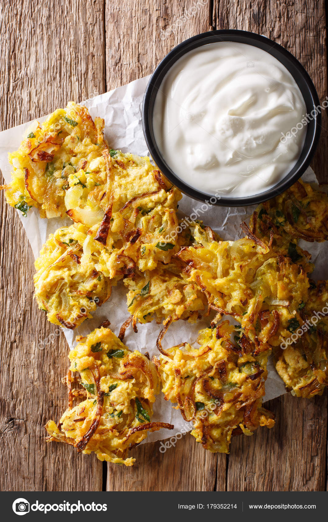 Indian food crispy fried onion Bhajis closeup. vertical top vi