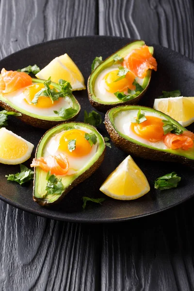 Healthy food baked avocado stuffed with egg and red fish closeup — Stock Photo, Image