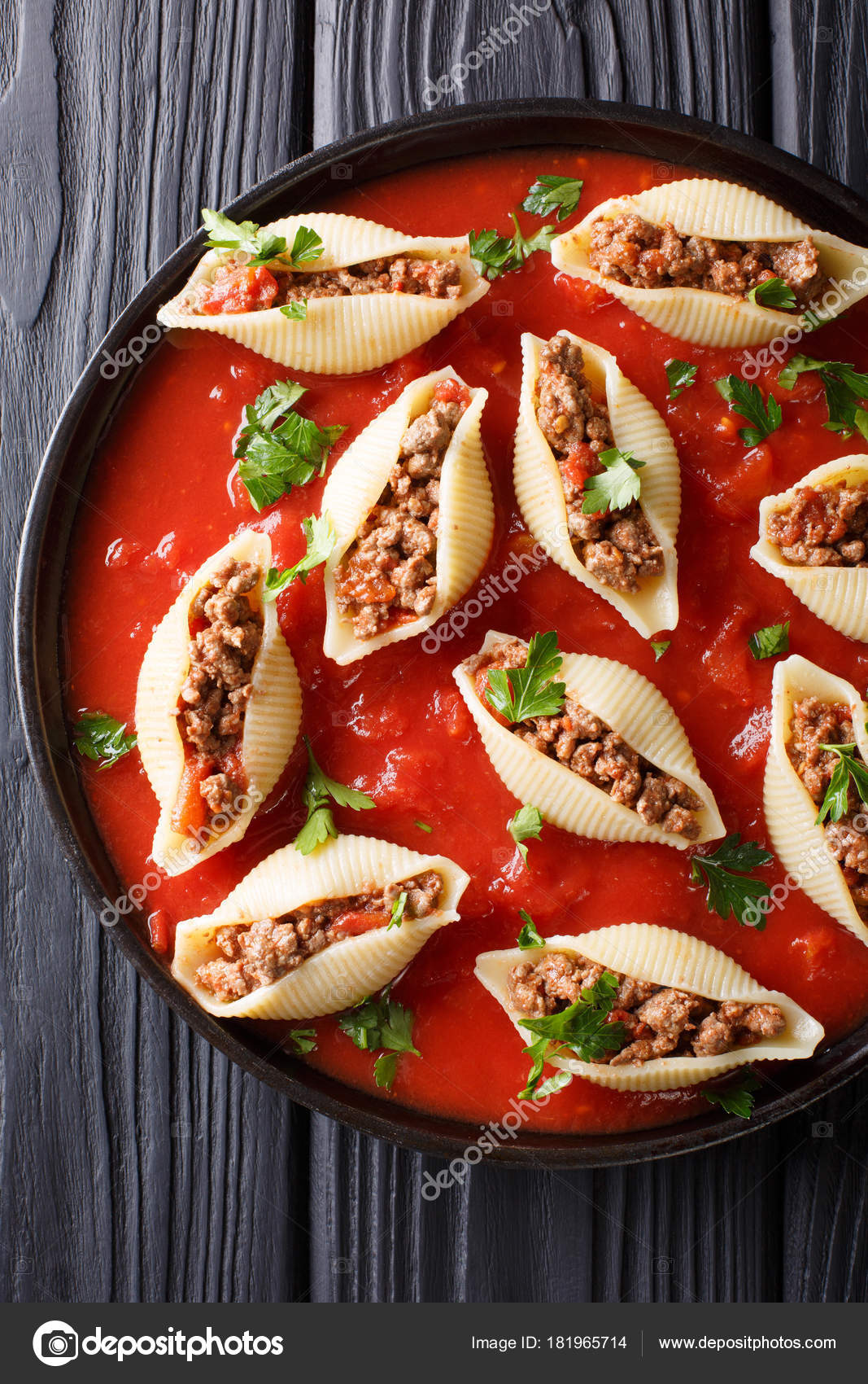 Italian cuisine: conchiglioni pasta stuffed with ground beef wit