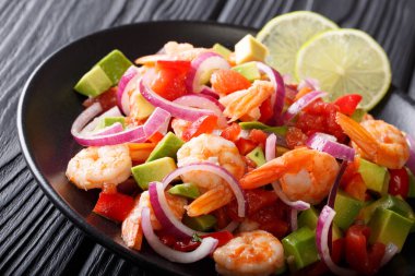 Spicy shrimp ceviche with vegetable salsa close-up on a plate. h clipart