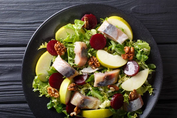 Freshly prepared mackerel salad with apples, walnuts, beets and — Stock Photo, Image