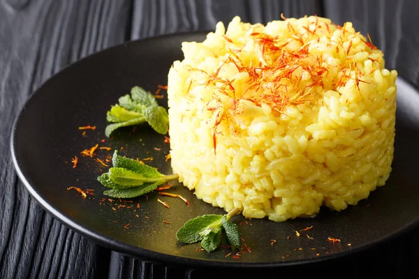Vegetarian Italian food: risotto with saffron and mint (Risotto