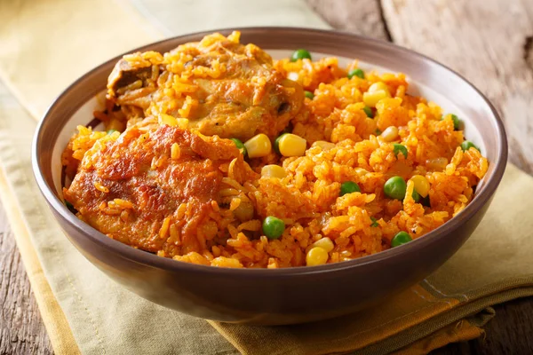 Brazilian Galinhada chicken and rice with peas and corn close-up