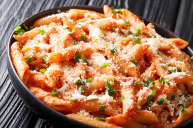 Tasty traditional pasta alla vodka topped with parmesan and pars