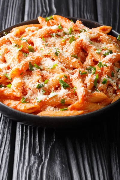 Italian penne pasta alla vodka topped with parmesan and parsley — Stok fotoğraf