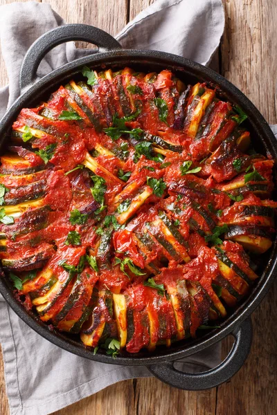 Greek cuisine Briam vegetable mix close-up in a pan. Vertical to