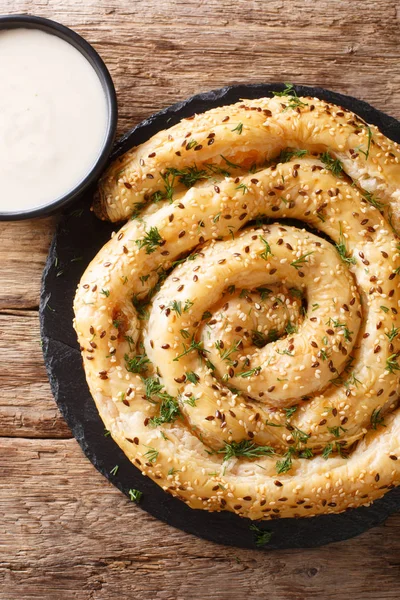 Homemade borek (burek) pie with feta cheese close-up. Vertical t — Stock Photo, Image