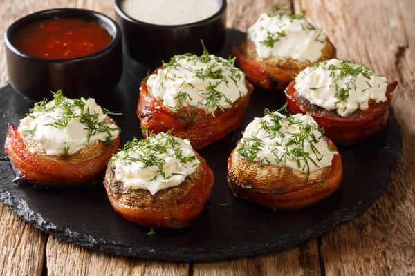 Baked mushrooms with cream cheese wrapped in bacon served with s — Stock Photo, Image