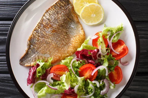 Tasty fried dorado fish fillet with fresh vegetable salad close- — Stock Photo, Image