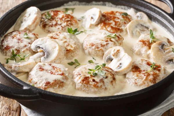 Hot meatballs with mushrooms served in creamy cheese sauce with — Stock Photo, Image
