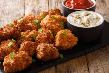 Delicious chicken nuggets breaded with coconut served with ketch