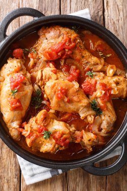 Diet rabbit meat stew in tomato sauce with white wine and herbs 