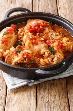 Braised rabbit in tomato sauce with white wine and herbs close-u