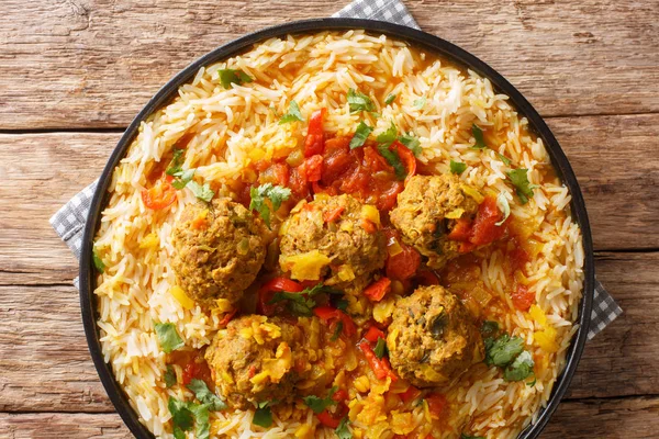Afghan meat balls in spicy sauce with yellow peas served with ba