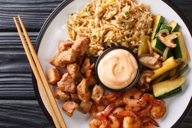 Full hibachi dish with rice, shrimp, steak and vegetables served