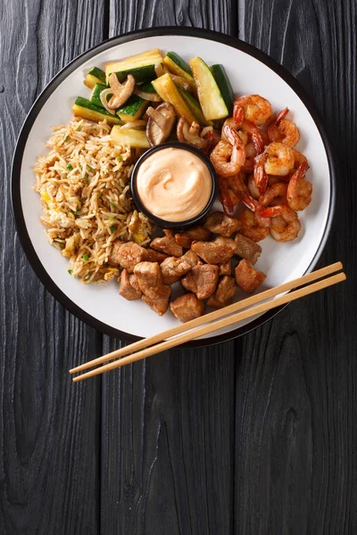 Hibachi dish consisting of fried rice with egg, shrimp, steak an — Stock Photo, Image