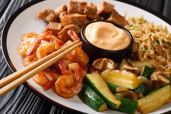 Full hibachi dish with rice, shrimp, steak and vegetables served