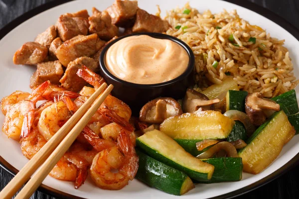 Hibachi dish consisting of fried rice with egg, shrimp, steak an — Stock Photo, Image