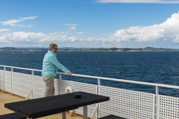 Adult woman in blue sweater on ferry — Stock Photo, Image
