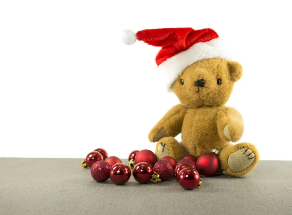 Teddy bear with red chritmas balls — Stock Photo, Image