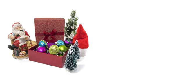 Santa claus and a box with christmas balls — Stock Photo, Image