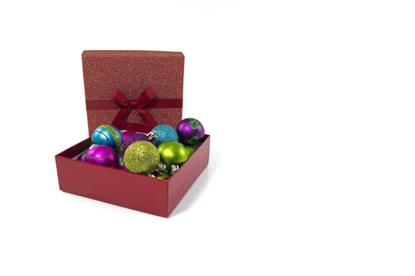 Gift boxes in red with christmas balls — Stock Photo, Image