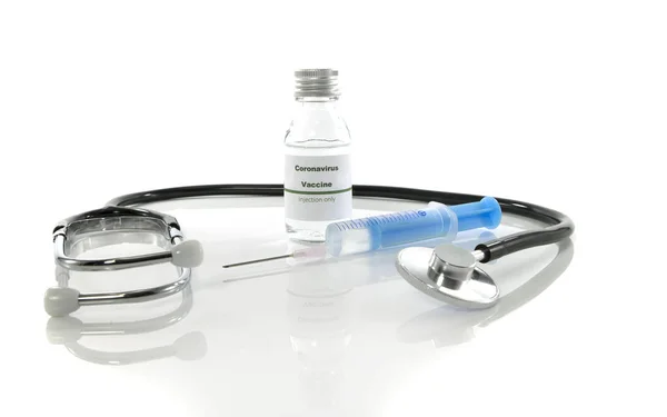 Coronavirus vaccine vial with injection syringe and stethoscope — Stock Photo, Image