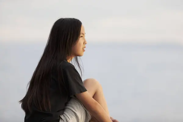 Asian Teenage Girl Sits Looking Out Water British Columbia Canada — Stock Photo, Image