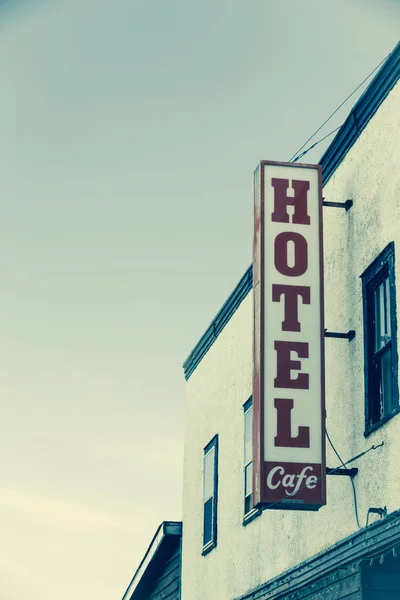 Hotel sign on the side of building — Stock Photo, Image