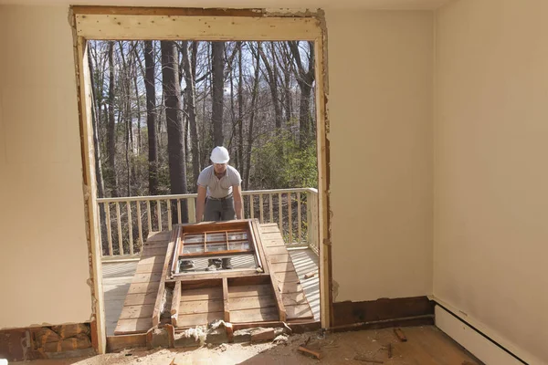 Hispanic Carpenter Removing Newly Cut Door Access Deck Home — Stock Photo, Image