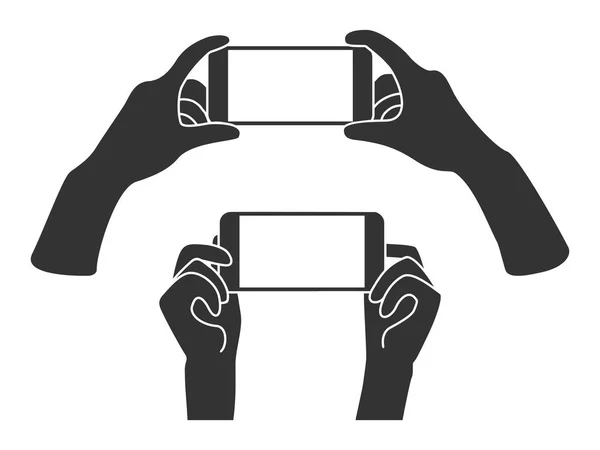 Telefonu yatay pozisyonda holding eller. Boş perde hareket eden telefon iletisi veya fotoğraf için.