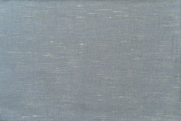 Plain linen fabric in pale blue. Background.