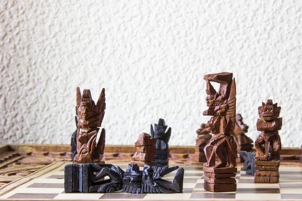 Chess of Bali, Indonesia. The good and evil characters of the Balinese epic are made from ebony and palm roots.