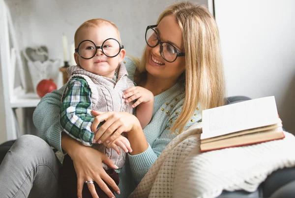 Mother and her son reading book at home — Stock Photo, Image
