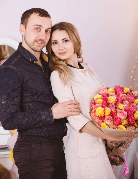 Young couple portrait with roses — Stock Photo, Image