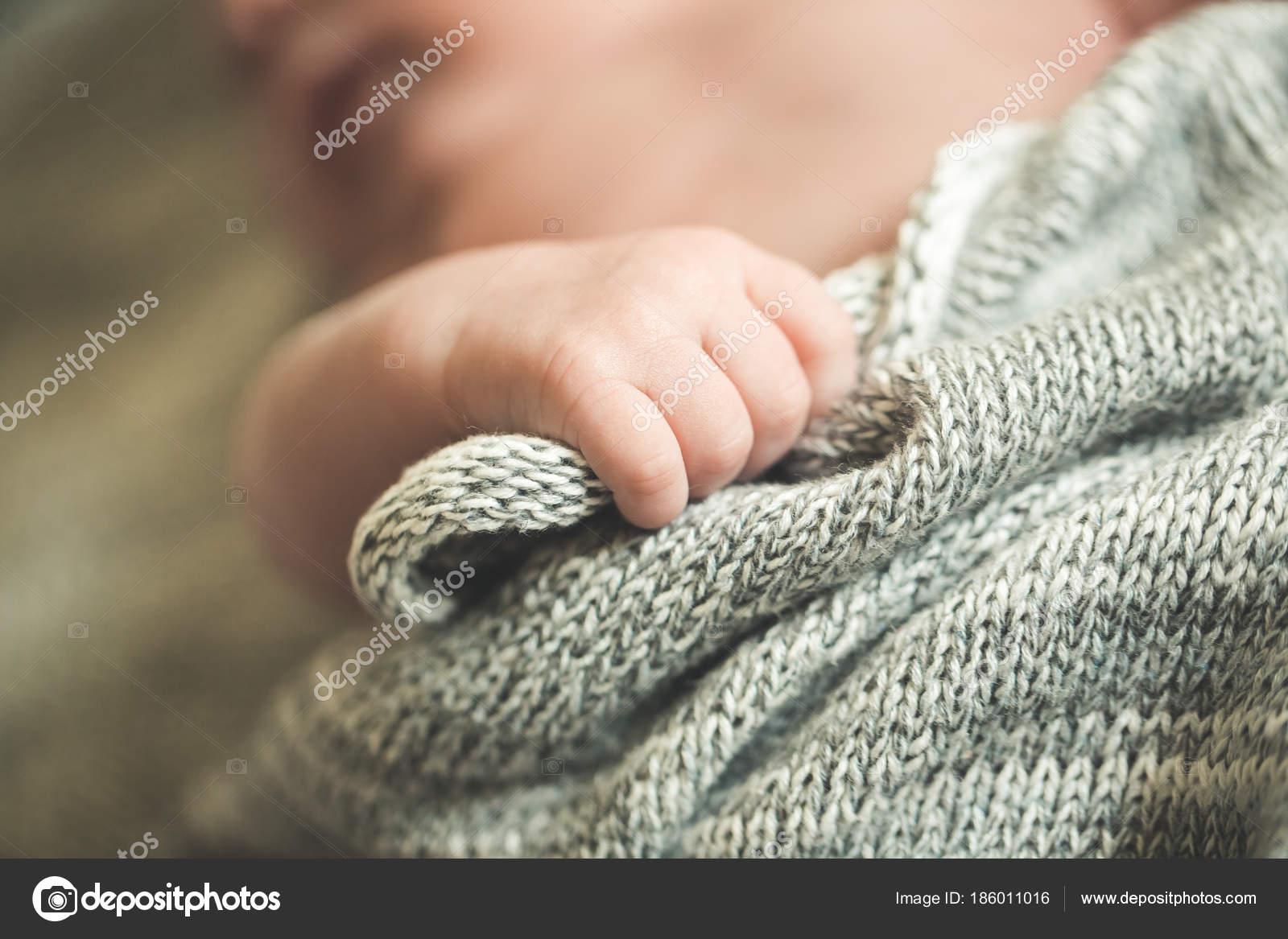 The child s hands hold a knitted blanket Stock Photo kirill grekov 186011016
