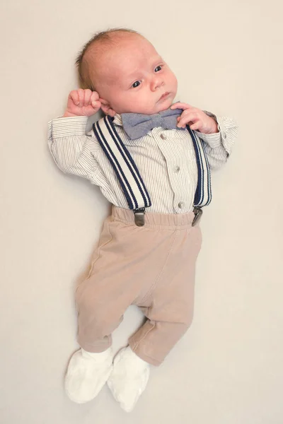 Newborn baby dressed like gentleman — Stock Photo, Image