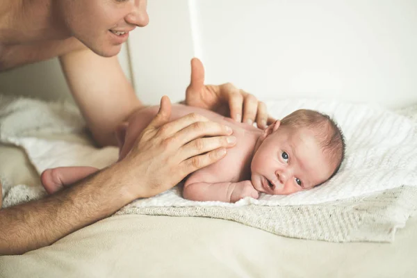 Dad is doing massage to a young son — Stock Photo, Image