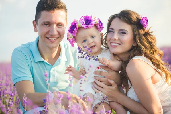 Young family in a lavender field — Stock Photo, Image