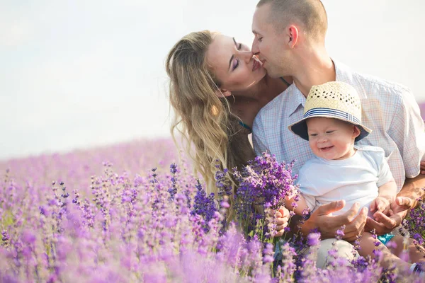 Young family in a lavender field — Stock Photo, Image