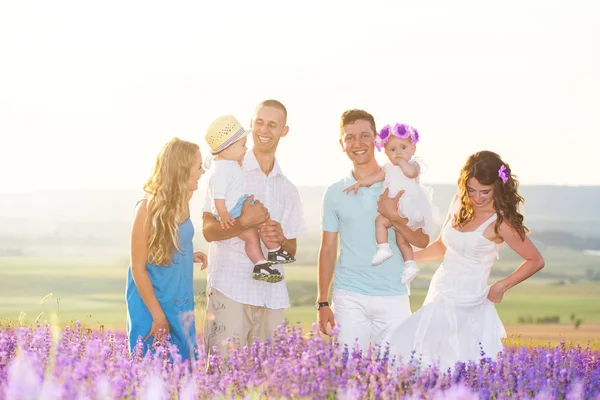 Two friendly family in a lavender field — Stock Photo, Image