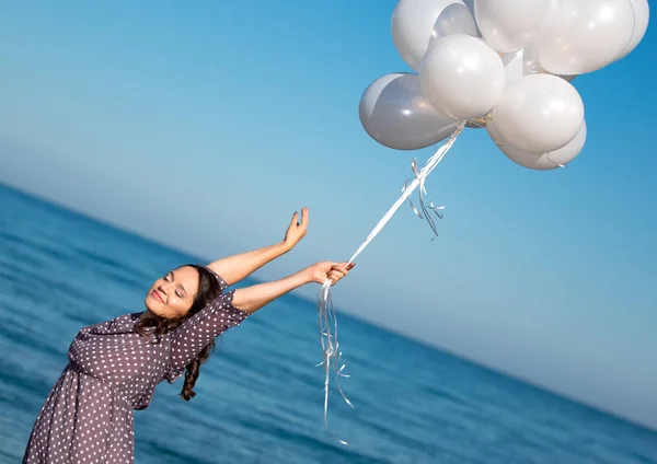 Plus size model posing with white balloons. — Stock Photo, Image
