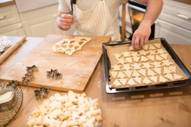Young man bakes cookies