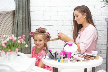 Mom and daughter do makeup